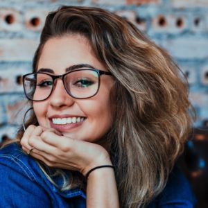 girl smiling wearing eyeglasses 640 300x300